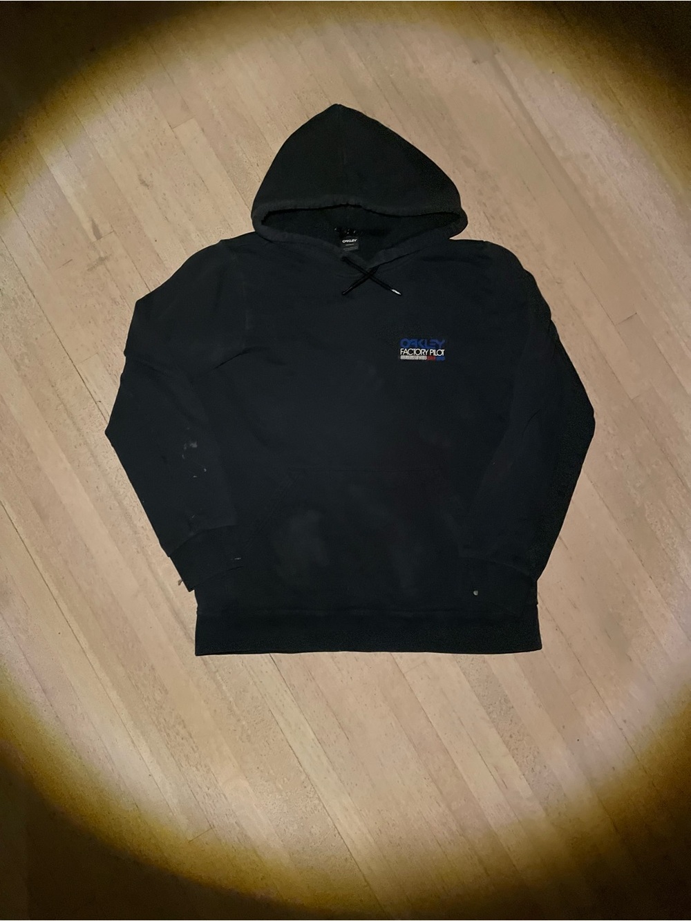Vintage black Oakley hoodie with white and blue graphic
